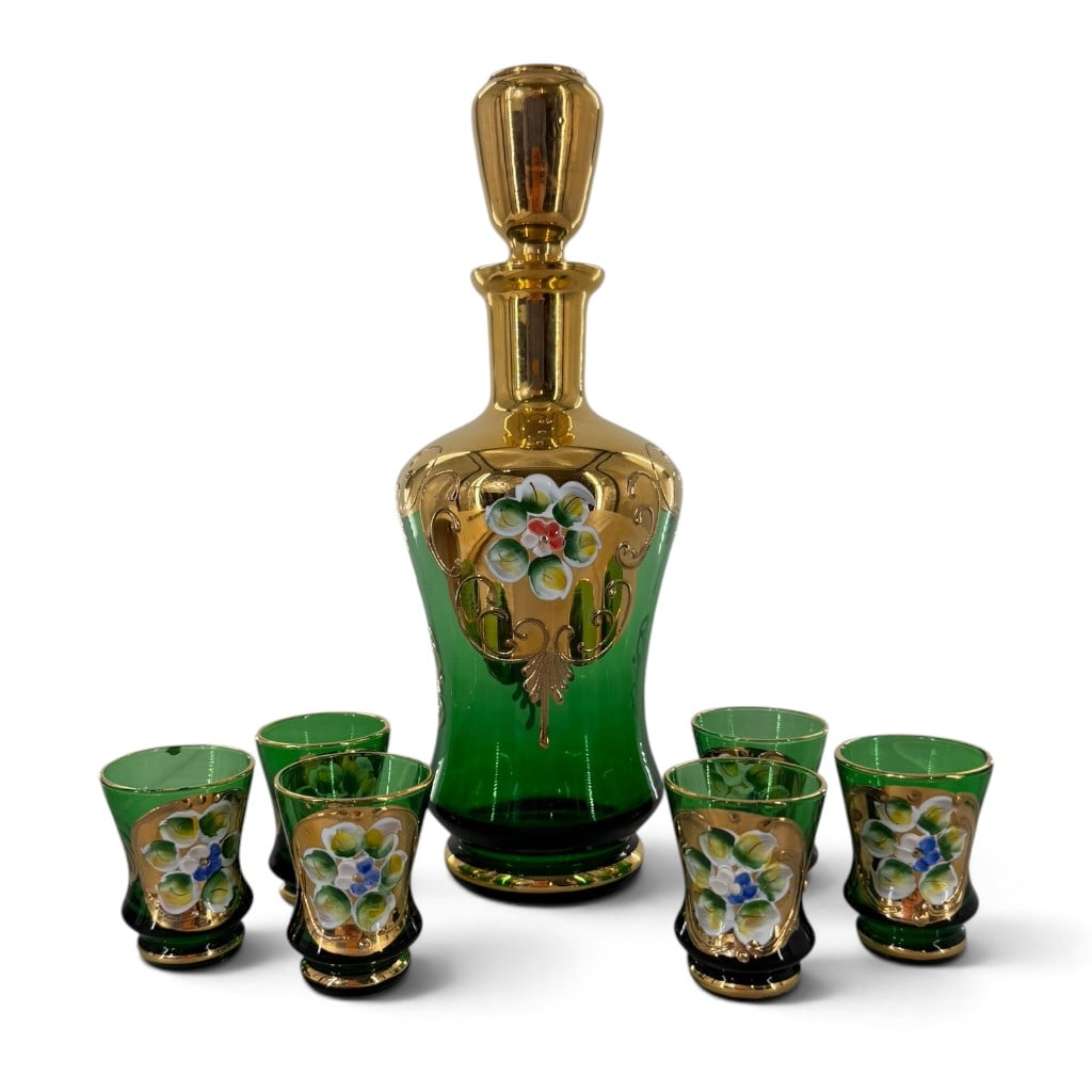 Bohemian Green Glass Decanter Set: Origin: Probably Czechoslovakia Date: Mid-20th century, circa 1950-1970 Period/Style: Mid-century Bohemian Maker: Unmarked Materials: Emerald-green glass with polychrome enamel and gilt decoration