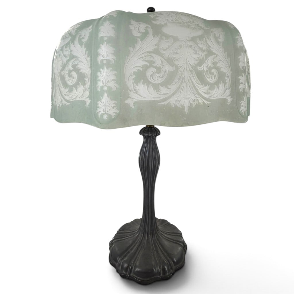 American Art Nouveau Etched Glass Table Lamp: Origin: Probably American Date: Circa 1915-1930 Period/Style: Art Nouveau and Art Deco transitional Maker: Unmarked Materials: Celadon-tinted etched glass, patinated cast metal, and brass electrical