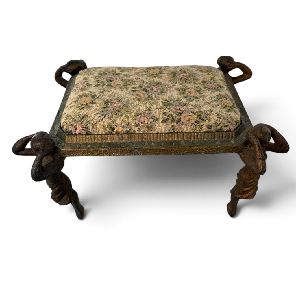 Art Deco Figural Cast-Iron Vanity Stool: Origin: Probably American Date: Early to mid-20th century Period/Style: Art Deco with Art Nouveau figural elements Maker: Unmarked Materials: Gilt and patinated cast iron, wood, padding, and floral ta