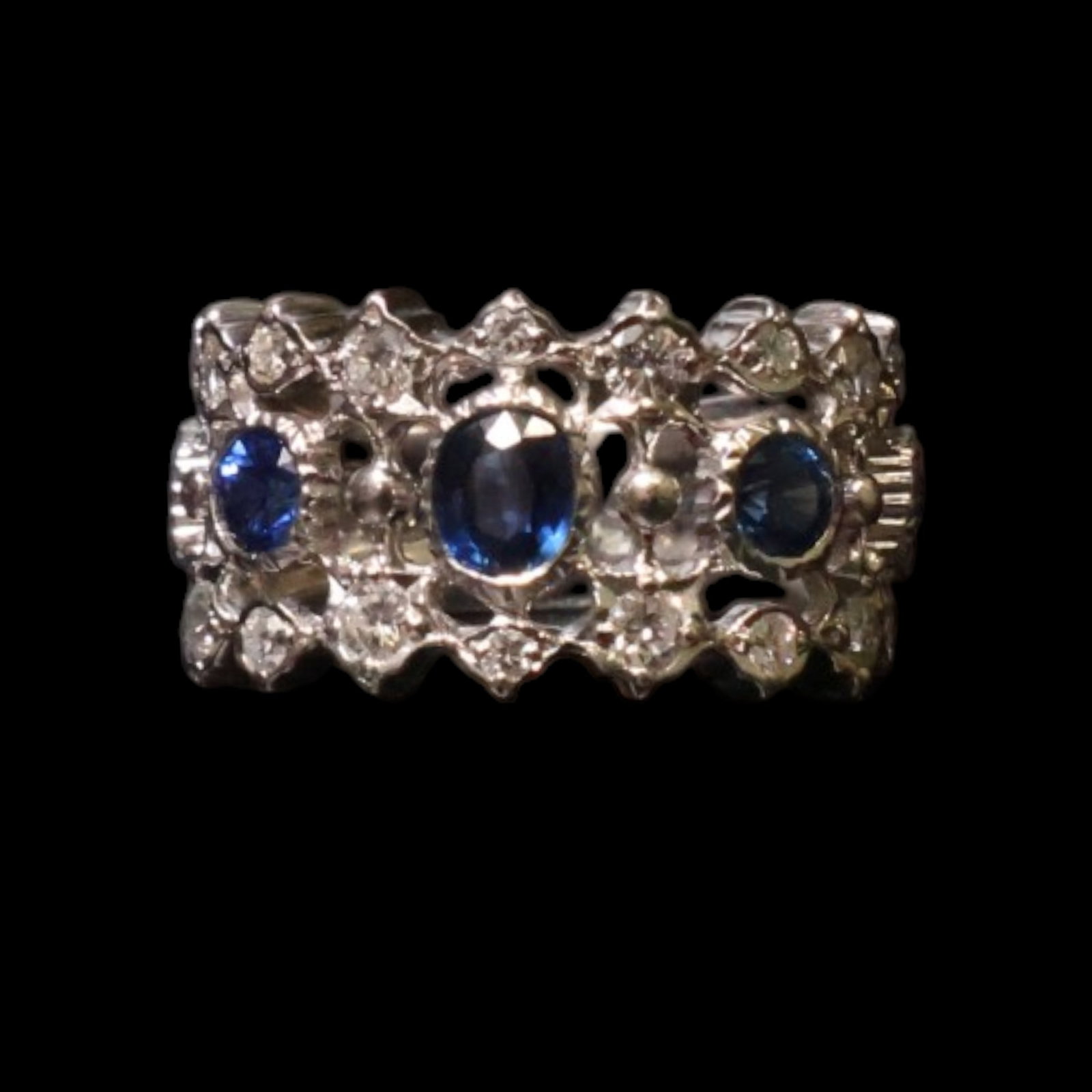 Platinum Sapphire and Diamond Ring: Date: Late 20th to early 21st century Materials: Platinum, sapphire, and diamonds Form: Ring Description: A platinum ring centered by a blue sapphire and surrounded by diamond accents. The consignor