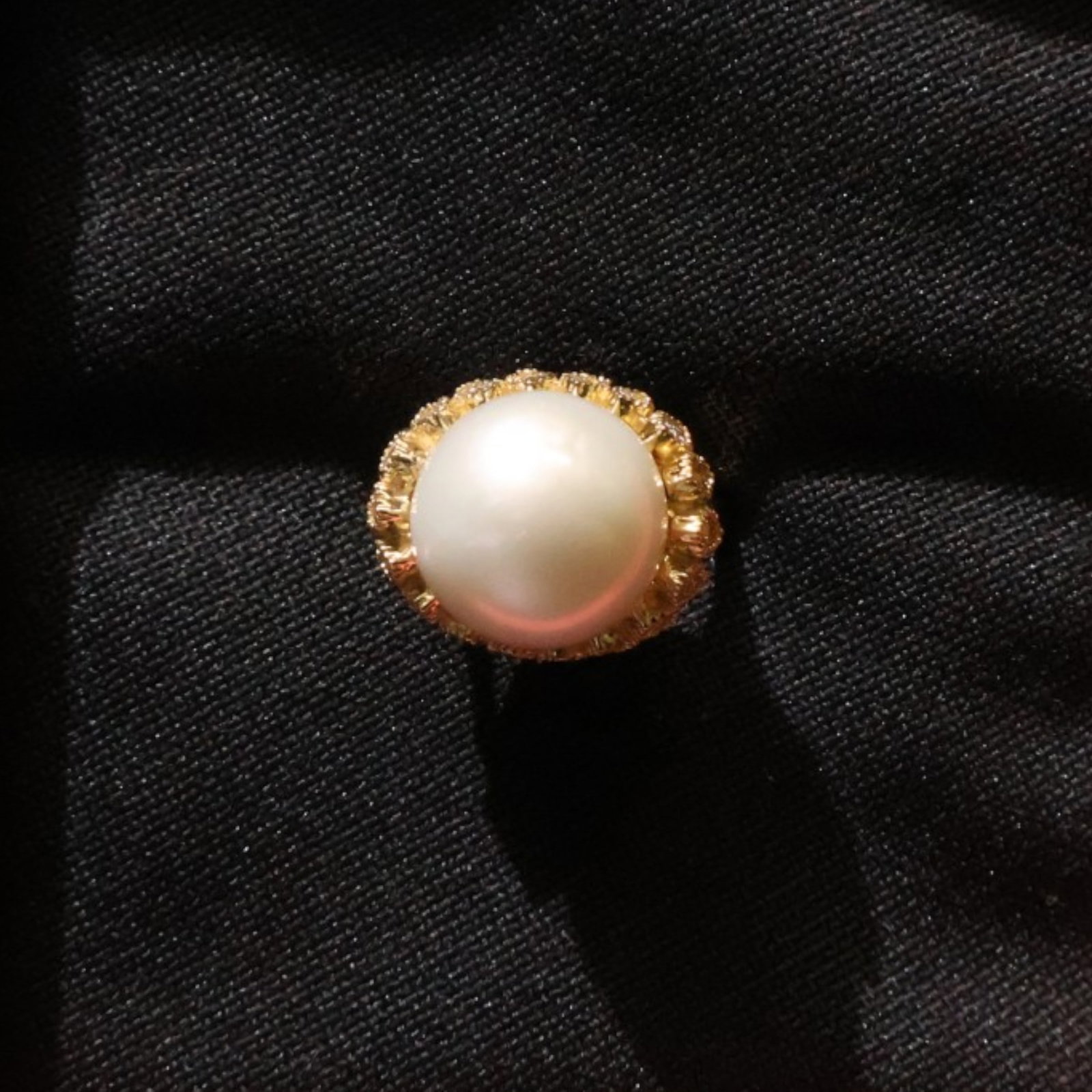 14K South Sea Pearl and Diamond Ring: Date: Late 20th to early 21st century Materials: 14K gold, South Sea pearl, and diamonds Form: Ring Description: A 14K gold ring mounted with an approximately 12 mm South Sea cultured pearl and