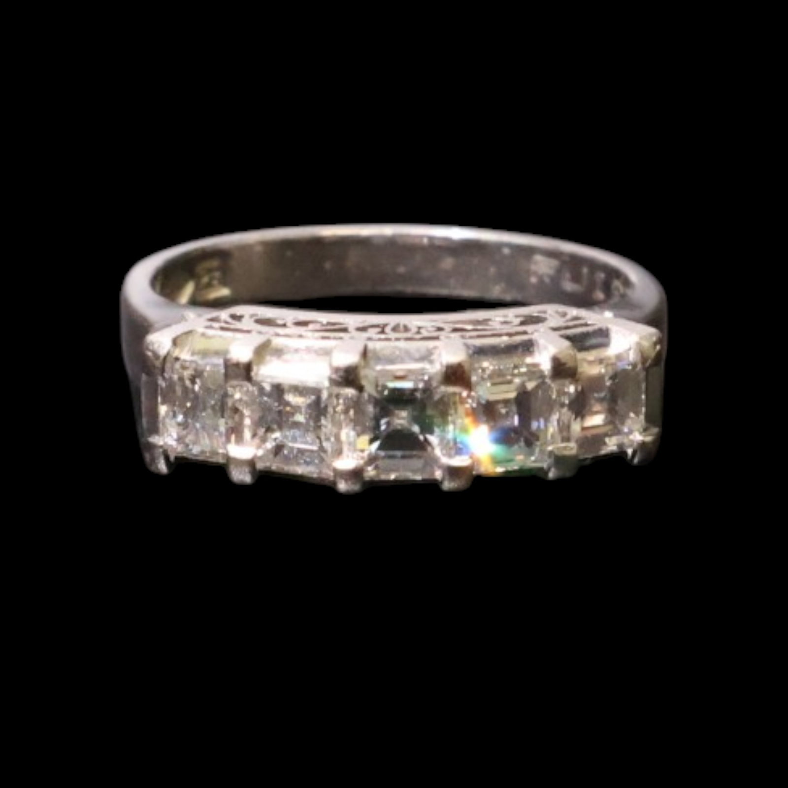 Platinum Asscher-Cut Diamond Band: Date: Late 20th to early 21st century Materials: Platinum and diamonds Form: Band ring Description: A platinum band set with Asscher-cut diamonds in a continuous geometric arrangement. The consignor