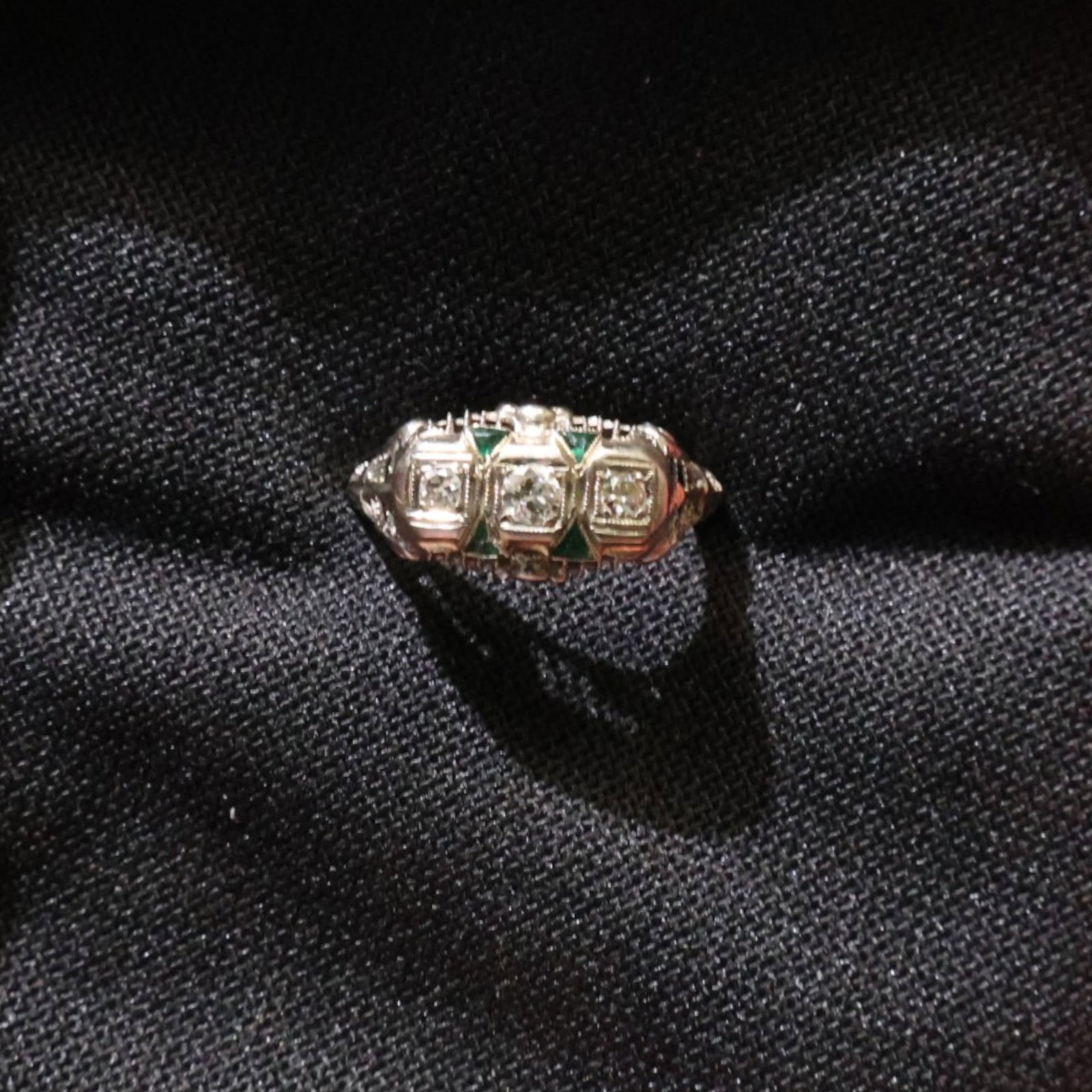 18K Old-Mine Diamond Sapphire Ring: Date: Early 20th century Materials: 18K gold, old-mine-cut diamond, and sapphires Form: Ring Description: An 18K gold ring centered by an old-mine-cut diamond and accented by sapphires in a compact