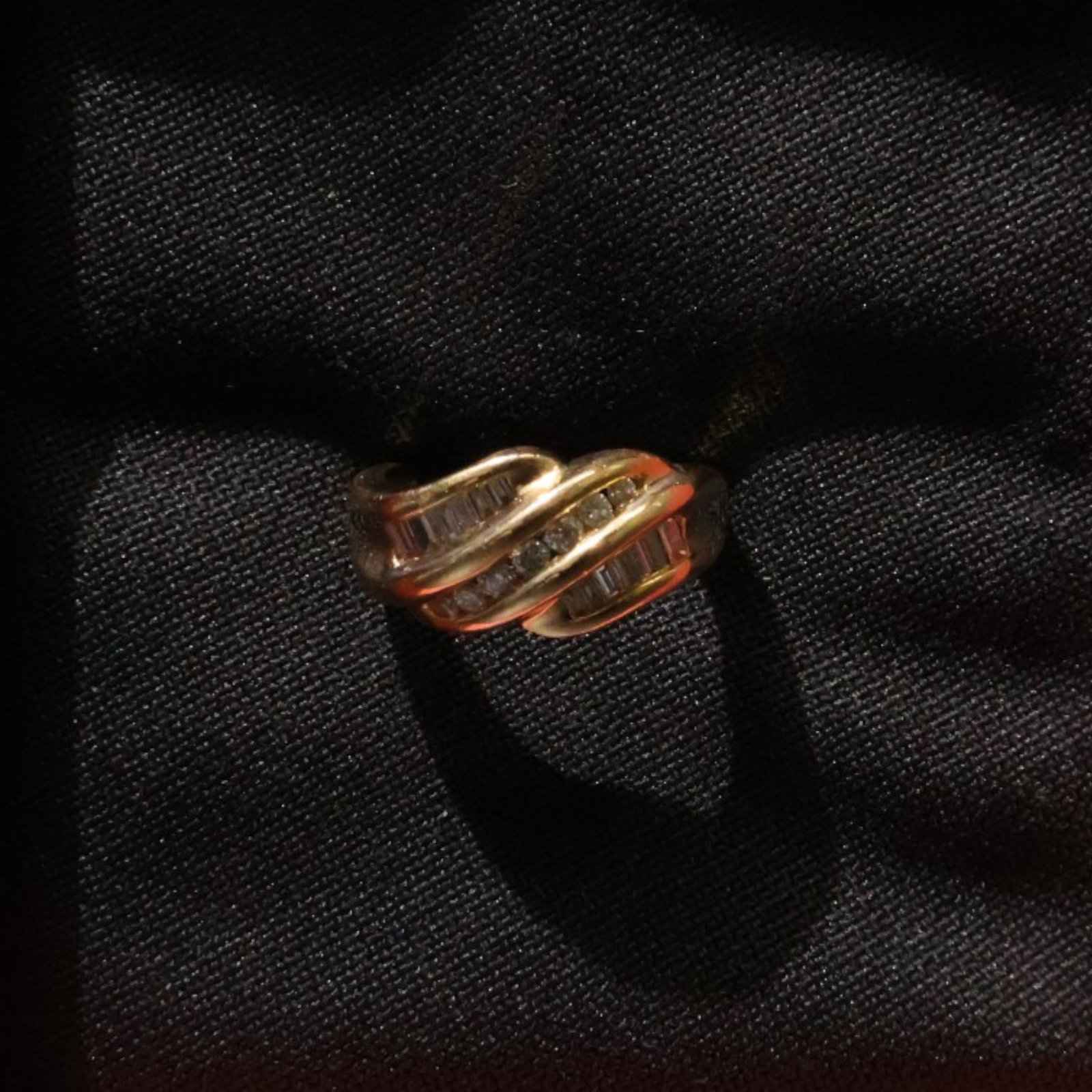 14K Round and Baguette Diamond Ring: Date: Late 20th to early 21st century Materials: 14K yellow gold and diamonds Form: Ring Description: A 14K yellow gold ring set with alternating round and baguette diamonds in a broad geometric