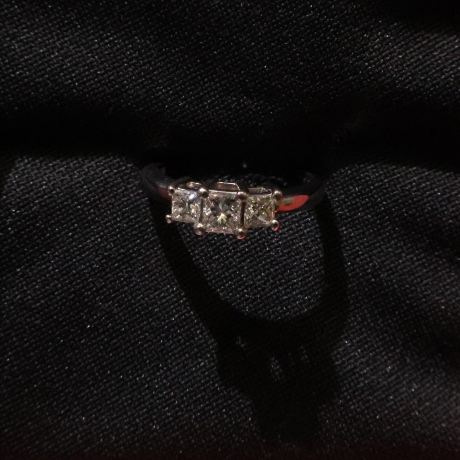 Two-Tone Cushion-Cut Diamond Ring: Date: Late 20th to early 21st century Materials: 14K white gold, platinum, and diamonds Form: Three-stone ring Description: A two-tone ring with a 14K white gold shank and platinum head, set with