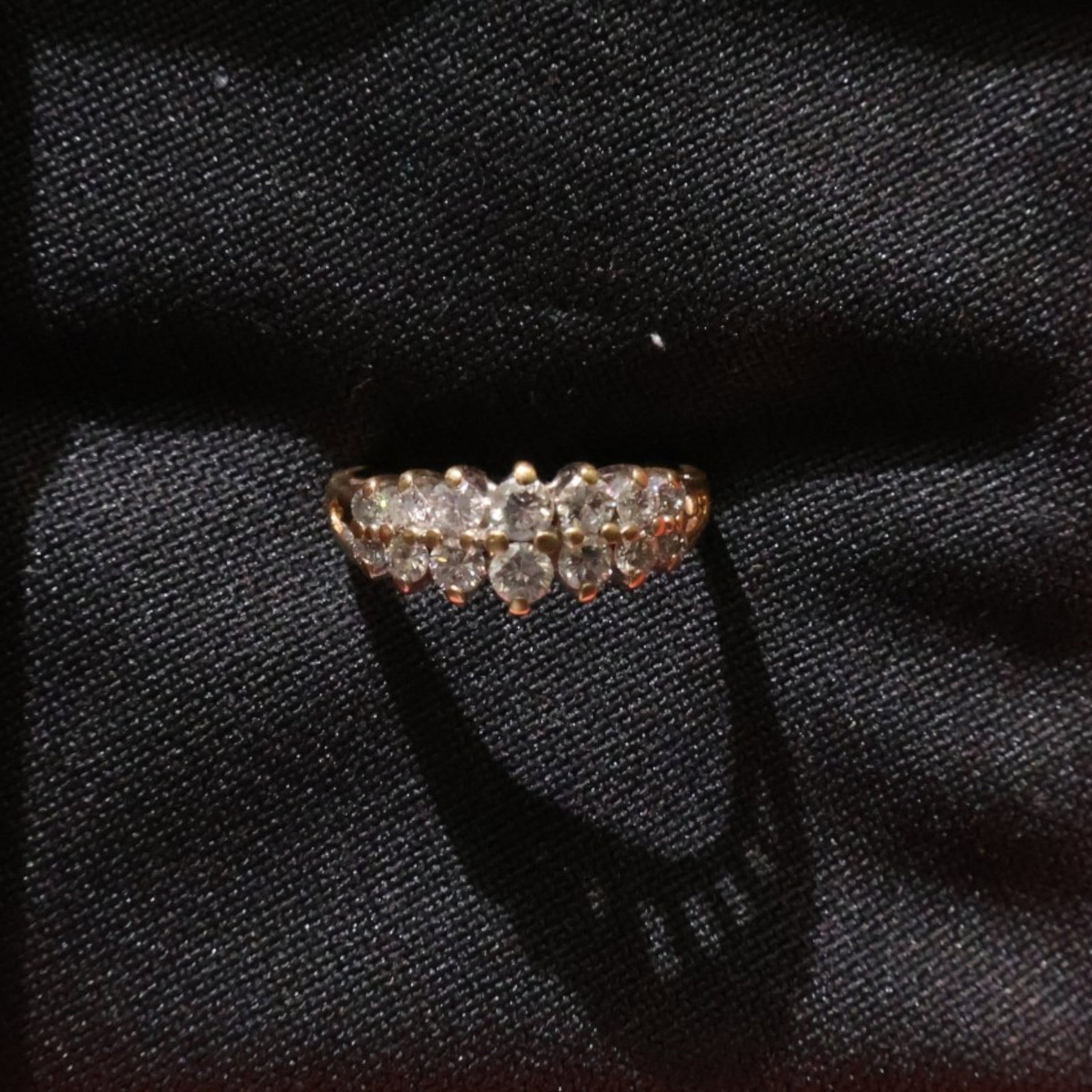 Yellow Gold Double-Row Diamond Ring: Date: Late 20th to early 21st century Materials: Yellow gold and diamonds Form: Ring Description: A yellow gold ring set with two parallel rows of diamonds across the top. Dimensions: Ring size 7.5