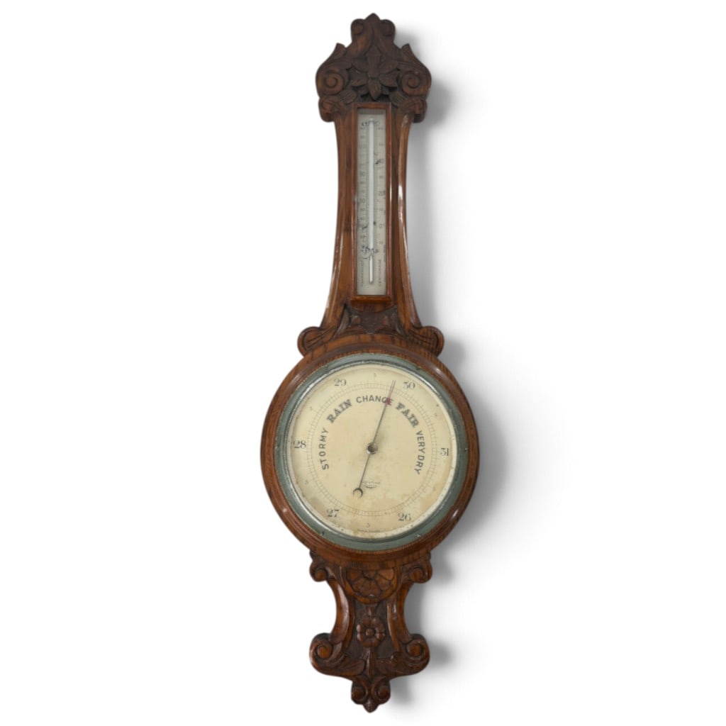 Short & Mason Carved Oak Aneroid Barometer: Origin: English Date: Early 20th century Period/Style: Edwardian Maker: Short & Mason, London Materials: Carved oak, metal, glass, and thermometer Form: Wall-mounted aneroid barometer and thermometer