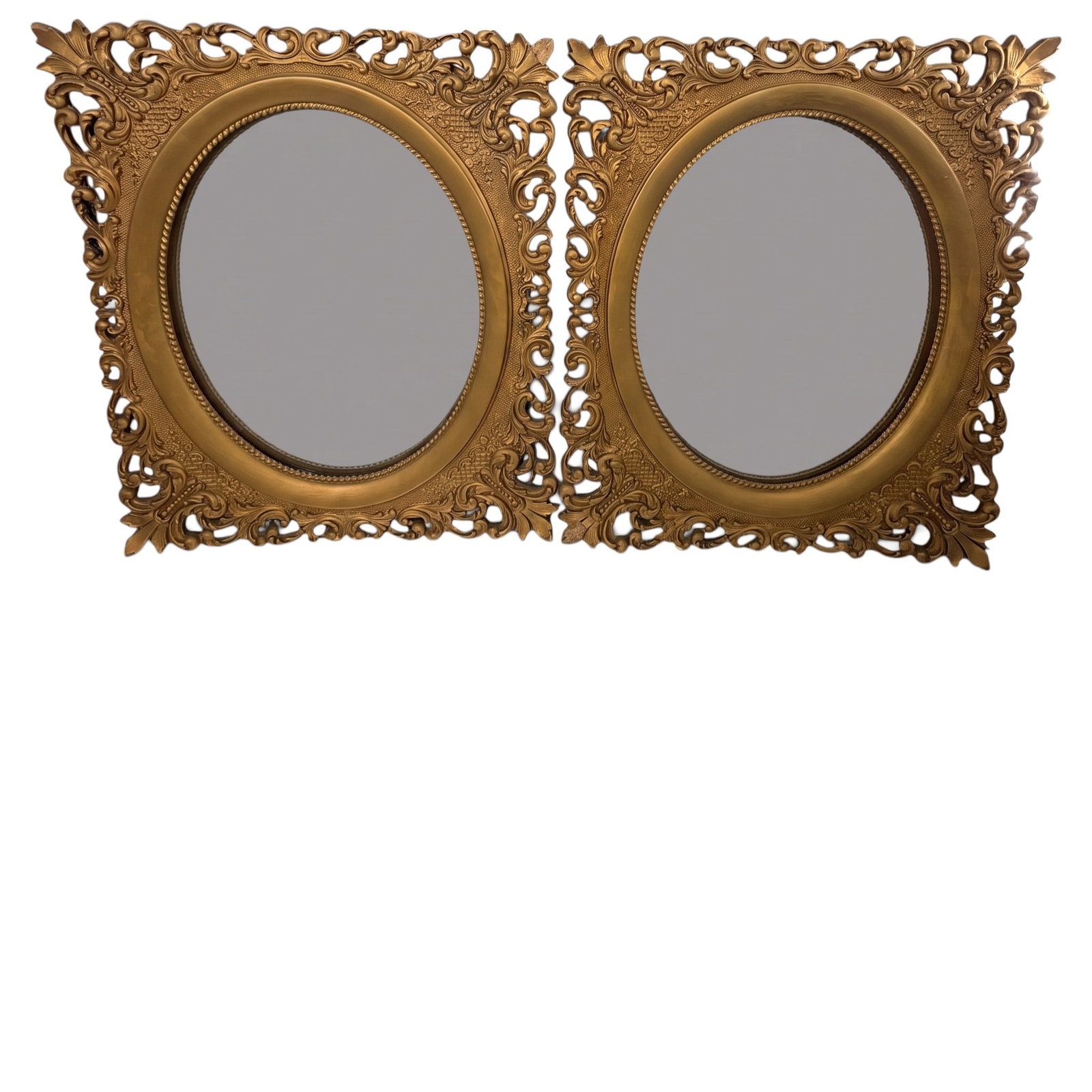 Pair Victorian Gilt Composition Mirrors: Origin: American or Continental Date: Late 19th to early 20th century Period/Style: Victorian / Rococo Revival Maker: Unattributed Materials: Gilt composition over wood, mirror glass, and paperboard