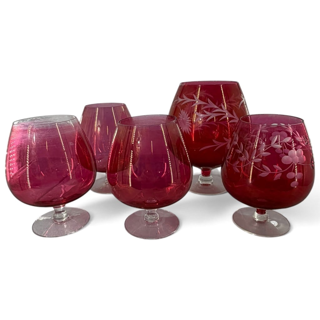 Five Cranberry Glass Stemmed Vessels: Origin: Continental Europe, probably Bohemian Date: Late 19th to early 20th century Period/Style: Victorian Maker: Various unidentified makers Materials: Cranberry and colorless glass with