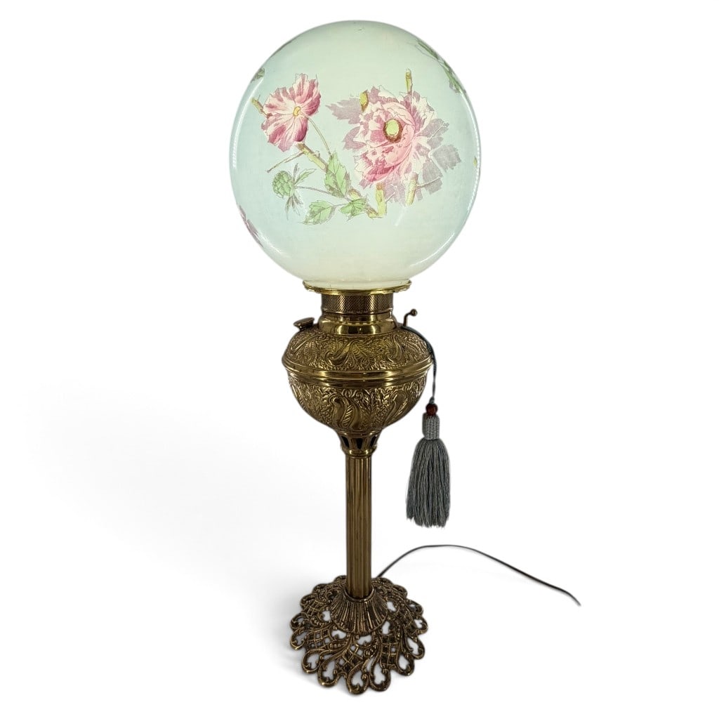 Victorian Gilt-Metal Floral Parlor Lamp: Origin: American Date: Circa 1900 Period/Style: Victorian Maker: Unattributed American manufacture Materials: Decorated opaline glass, gilt and brass-tone metal, and electrical fittings Form: