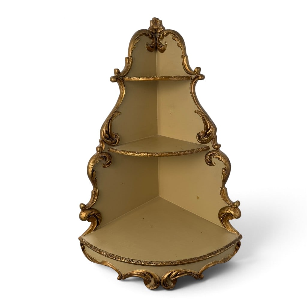 Italian Rococo-Style Gilt Corner Etagere: Origin: Italy Date: Mid to late 20th century Period/Style: Rococo Revival Maker: Unattributed Italian manufacture Materials: Painted and gilt wood with applied composition ornament Form: Three-tier