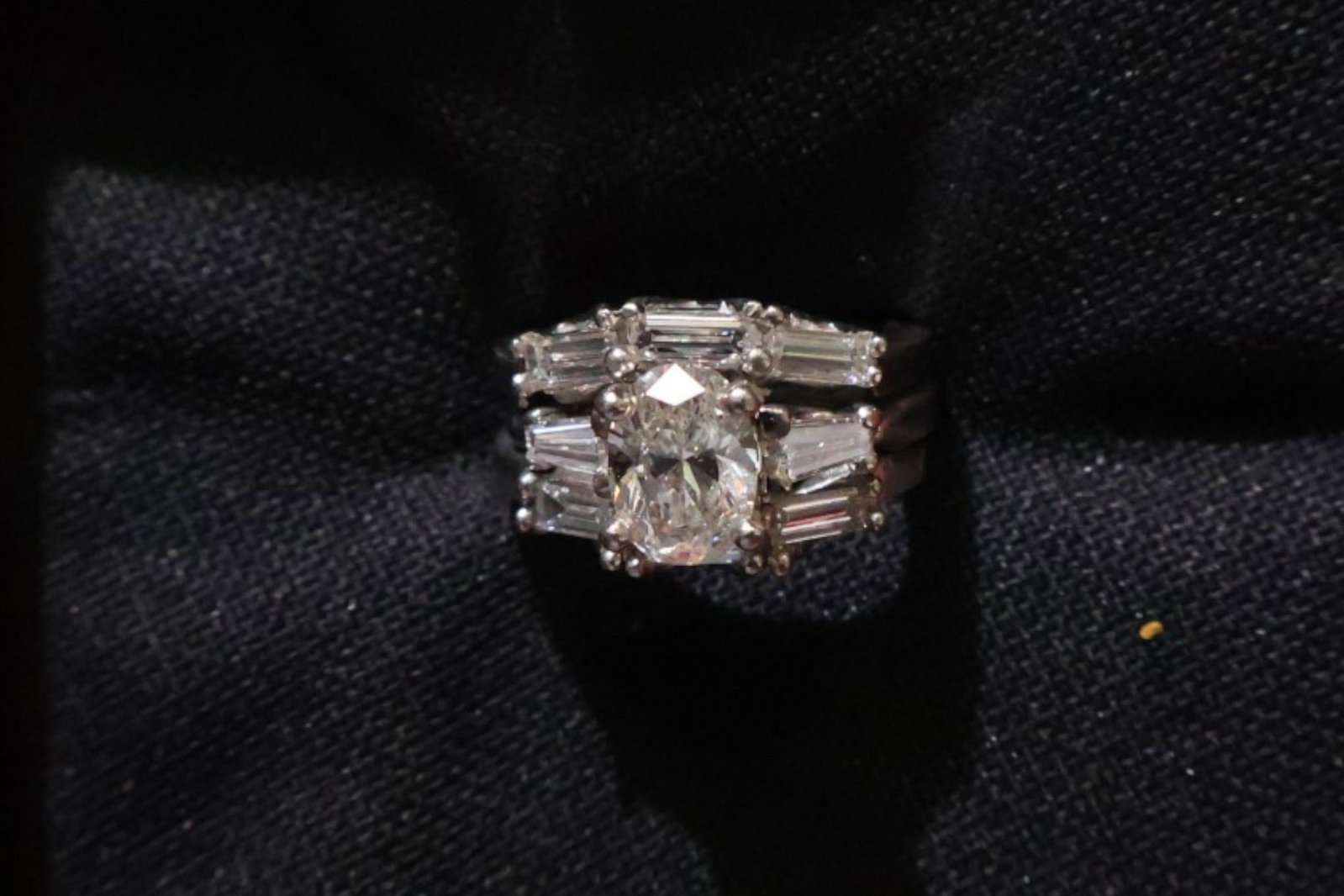 Platinum Three-Piece Diamond Wedding Set: Date: Late 20th to early 21st century Materials: Platinum and diamonds Form: Three-ring wedding set Description: A coordinated platinum three-piece wedding set comprising an oval-diamond engagement