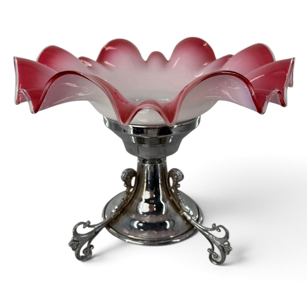 Victorian Cranberry Glass Pedestal Basket: Origin: United States, glass possibly American or Continental Date: Late 19th century Period/Style: Victorian Maker: Unidentified Materials: Blown cased cranberry and opalescent glass with