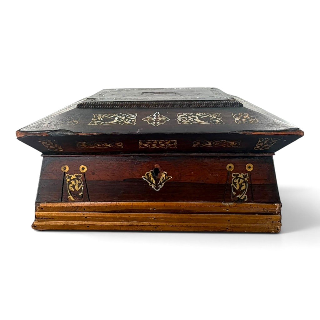 Victorian Rosewood Mother-of-Pearl Workbox: Origin: Probably England Date: Mid-19th century Period/Style: Early Victorian Maker: Unattributed Materials: Rosewood veneer, secondary wood, mother-of-pearl, brass, paper, and textile Form: Sa