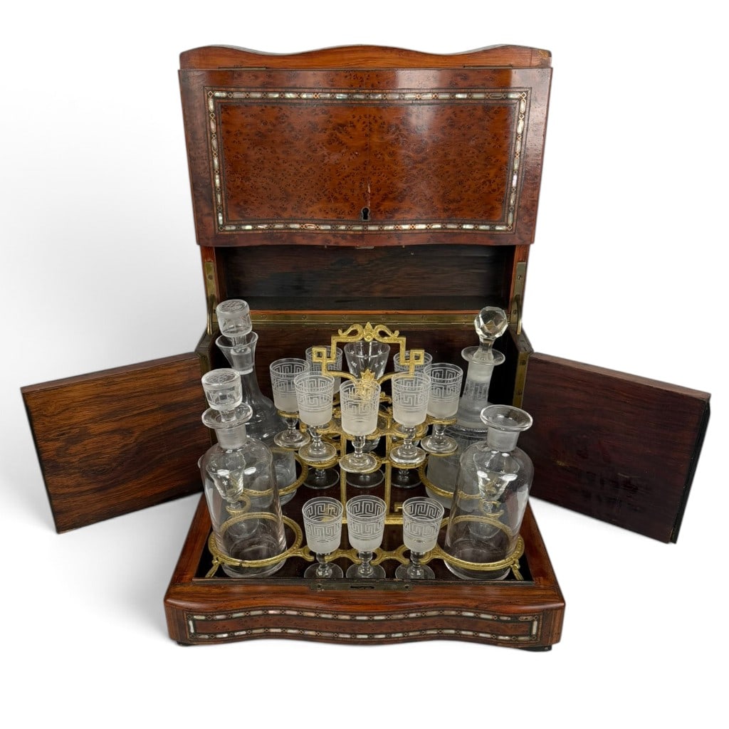 Napoleon III Inlaid Burlwood Cave a Liqueur: Origin: French Date: Late 19th century, circa 1870-1890 Period/Style: Napoleon III Maker: Unidentified Materials: Burlwood veneer, mother-of-pearl and brass inlay, gilt metal, mirrored glass, etched g