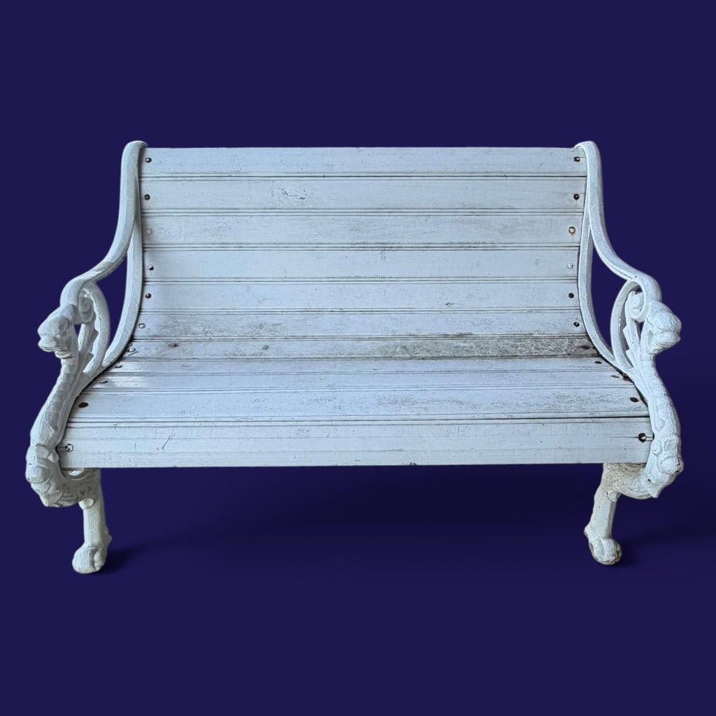 Victorian-Style Dragon Cast Iron Garden Bench: Date: 20th century Period/Style: Victorian Revival Maker: Unidentified Materials: White-painted cast iron and painted slatted seat and back Form: Garden bench Description: A white-painted garden