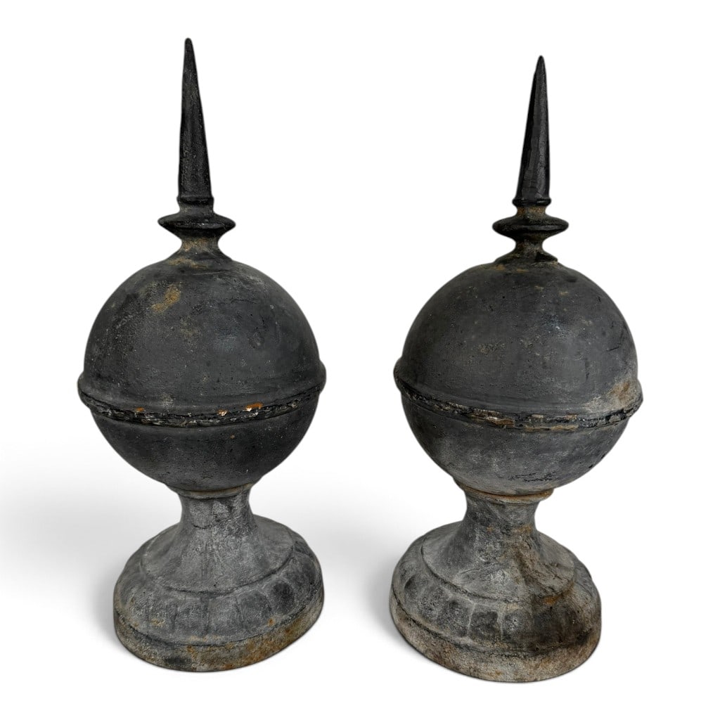 Pair Cast Iron Ball-and-Spire Finials: Date: 20th century Period/Style: Traditional architectural Maker: Unidentified Materials: Cast iron with dark-painted finish Form: Pair of architectural finials Description: A pair of cast-iron