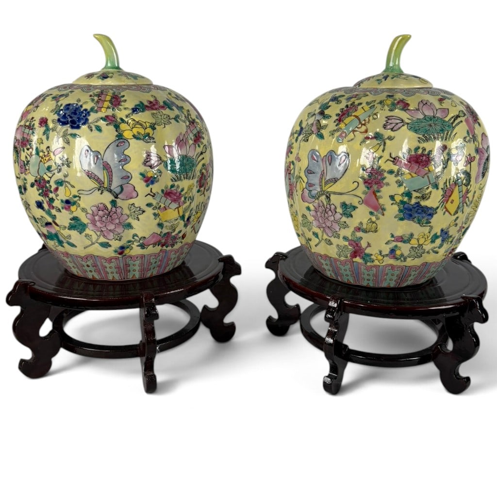 Pair Chinese Famille Rose Pumpkin Jars: Origin: China Date: 20th century Period/Style: Famille rose and Qing Revival Maker: Unidentified Materials: Porcelain with polychrome enamels and gilt, carved hardwood Form: Pair of covered pum