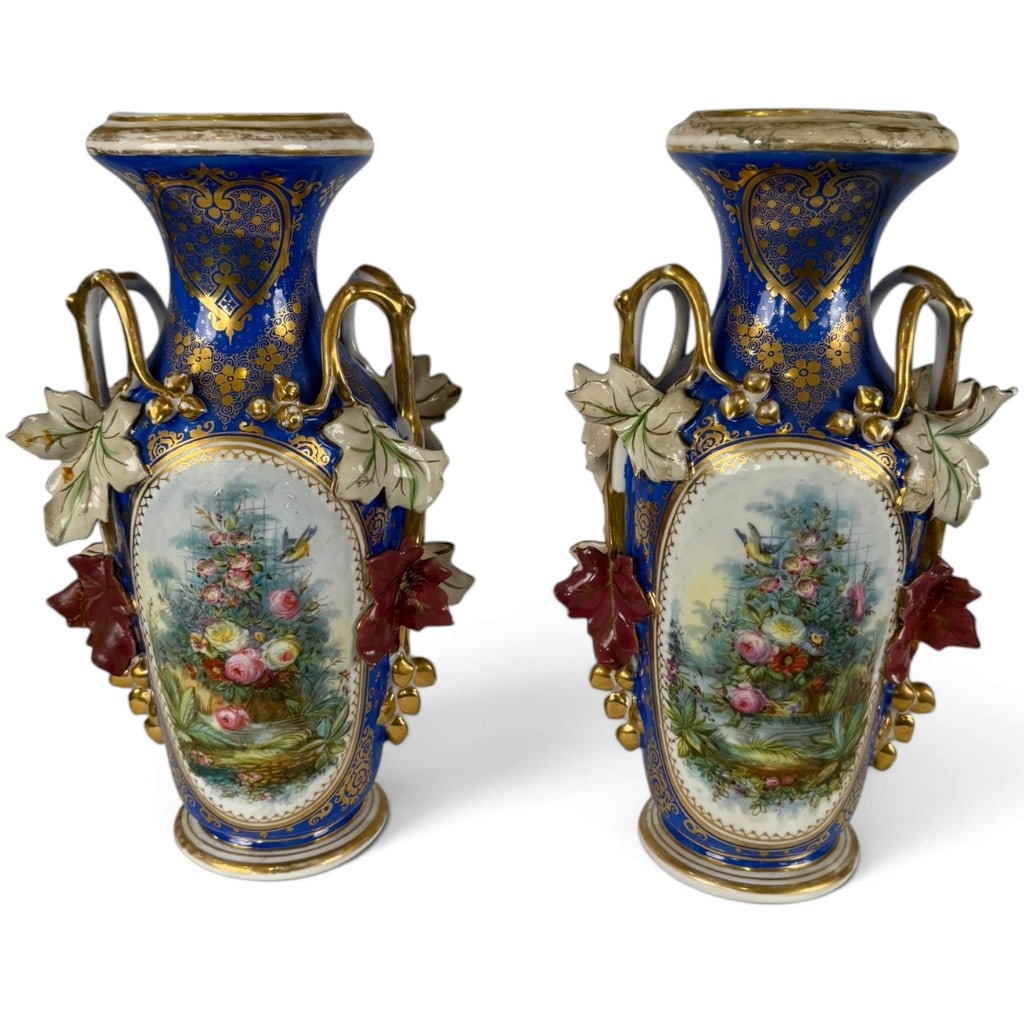 Pair Old Paris Cobalt Floral Porcelain Vases: Origin: French Date: Circa 1850-1870 Period/Style: Old Paris porcelain and Rococo Revival Maker: Unidentified Materials: Glazed porcelain with cobalt enamel, polychrome painting, applied porcelain orn