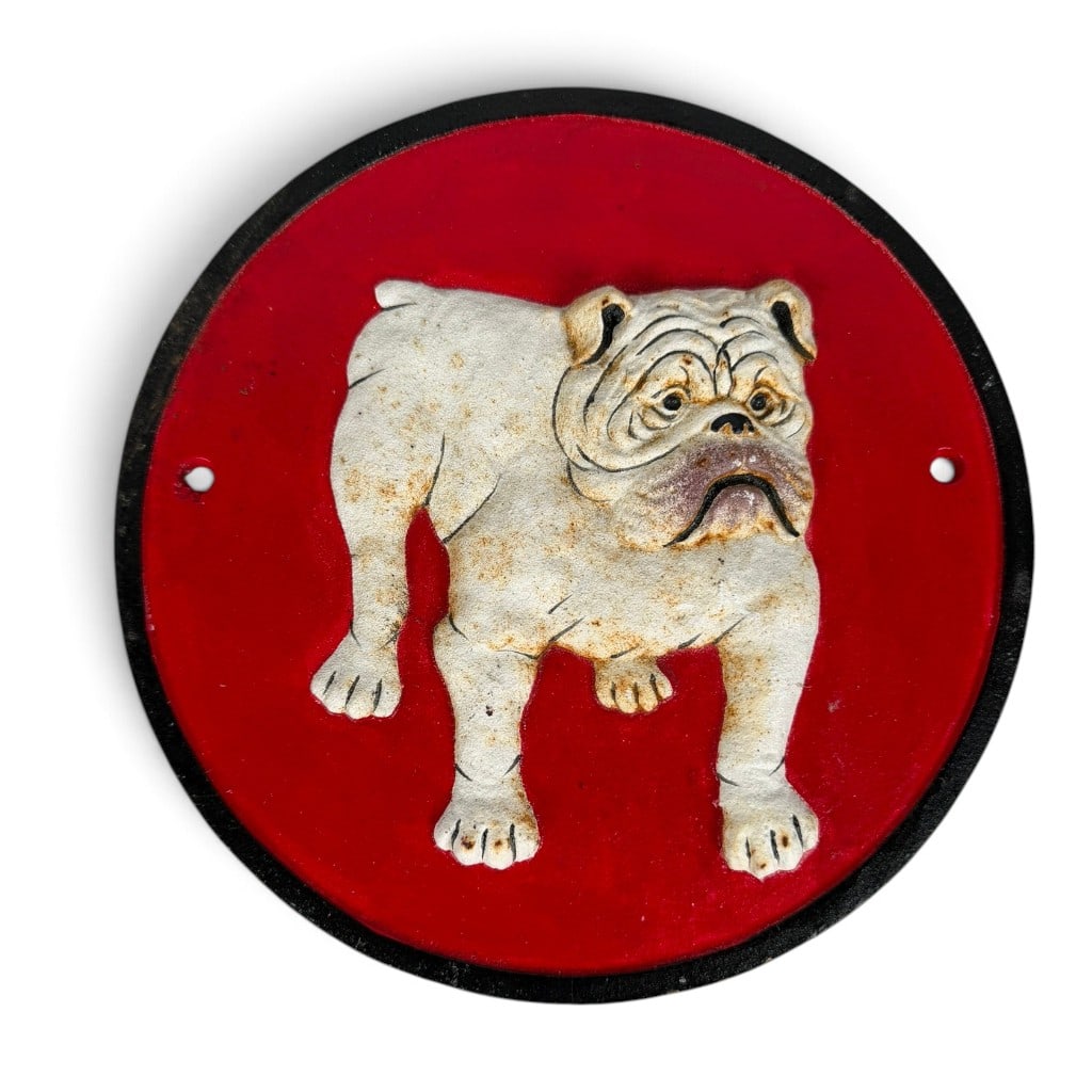 Painted Cast-Iron Bulldog Wall Plaque: Origin: Probably American Date: Late 20th century Period/Style: Vintage decorative Maker: Unidentified Materials: Painted cast iron Form: Circular wall plaque Description: Vintage circular cast-iron