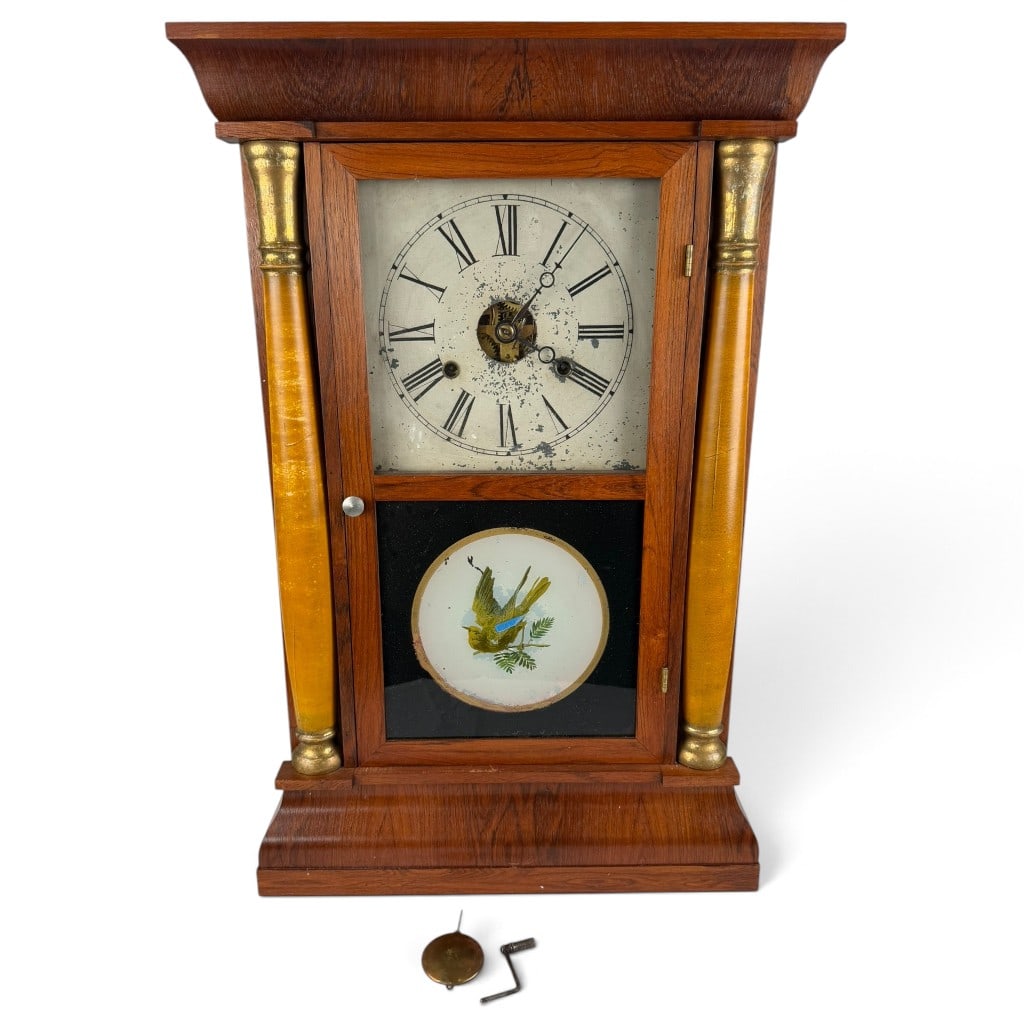 E.N. Welch Thirty-Hour Shelf Clock: Origin: Forestville, Connecticut, United States Date: Circa 1870 Period/Style: American Victorian Maker: E.N. Welch Manufacturing Company Materials: Veneered wood, brass, iron, glass, painted metal