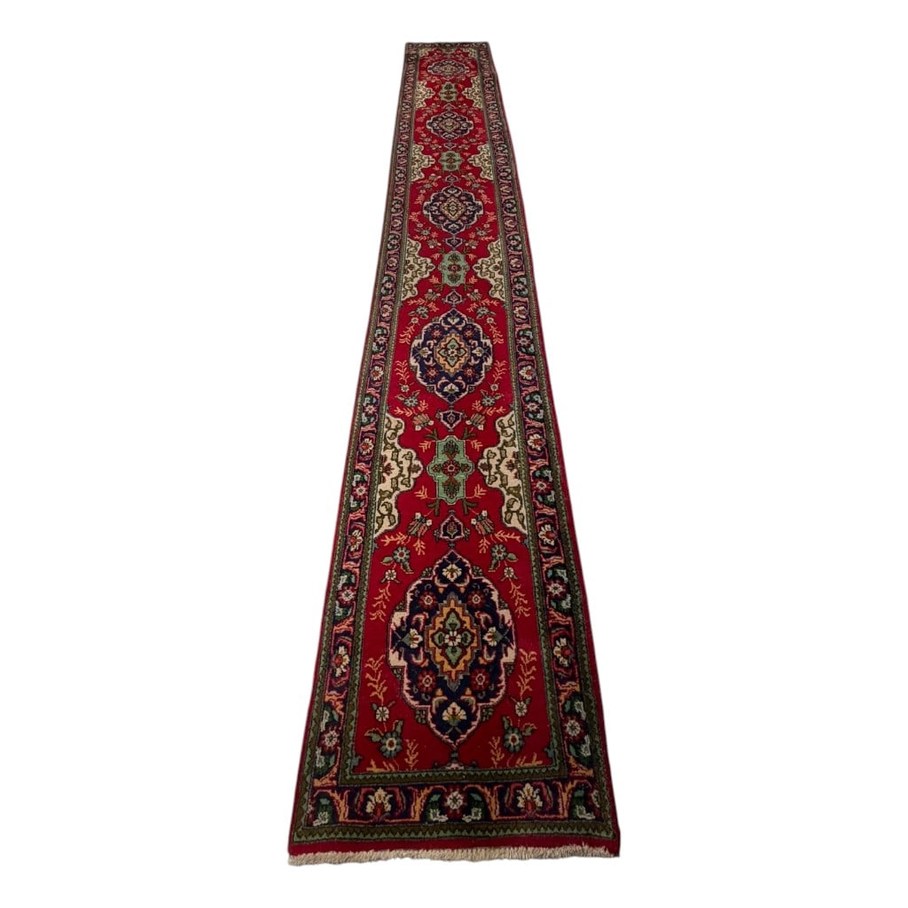 Persian Tabriz Wool Runner, 16 Ft.: Origin: Persia Date: Mid to late 20th century Period/Style: Tabriz Maker: Unidentified workshop Materials: Hand-knotted wool pile on a foundation Form: Long runner rug Description: A long Persian