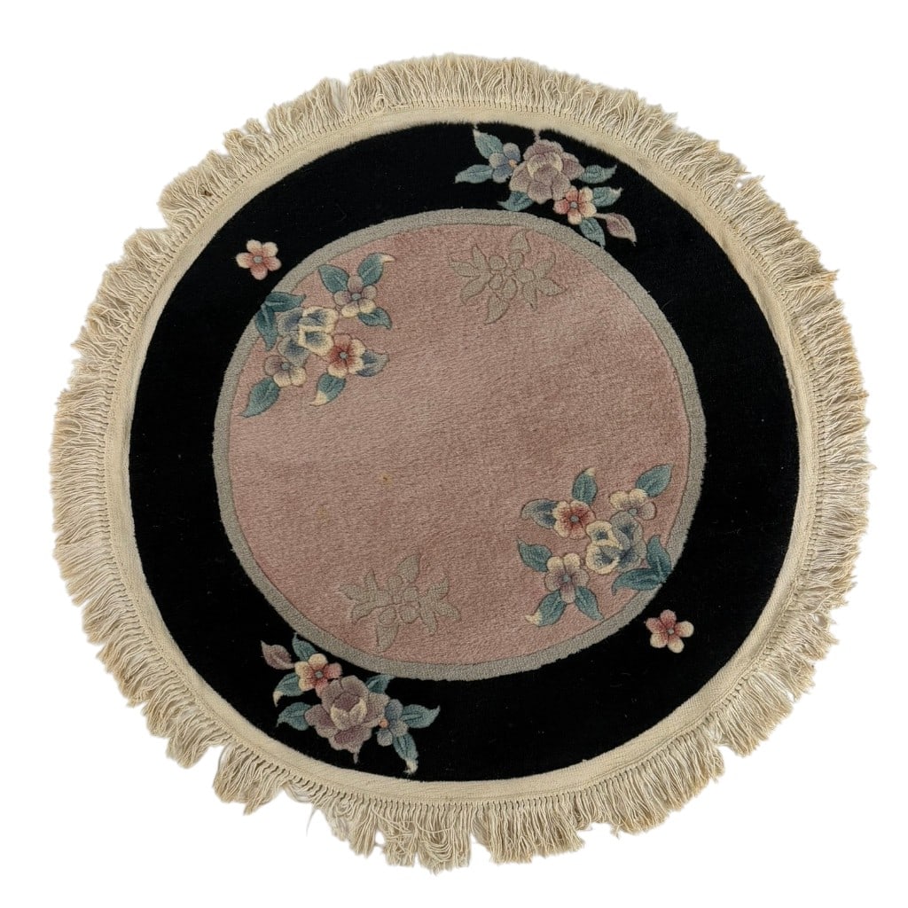 Chinese Art Deco-Style Round Wool Rug: Origin: Probably Chinese Date: Mid to late 20th century Period/Style: Art Deco style Maker: Unidentified workshop Materials: Wool pile Form: Round rug Description: A circular wool rug in the Chinese