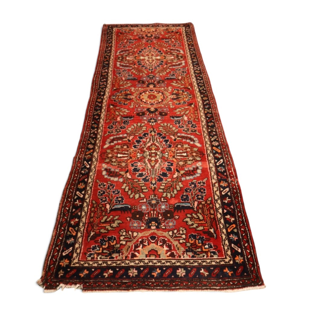 10 ft. x 3 ft. 7 in. Persian Floral Runner: Origin: Persia (Iran) Date: 20th century Period/Style: Traditional Persian floral design Materials: Wool pile on a woven foundation Form: Hand-knotted runner Description: A hand-knotted Persian wool r