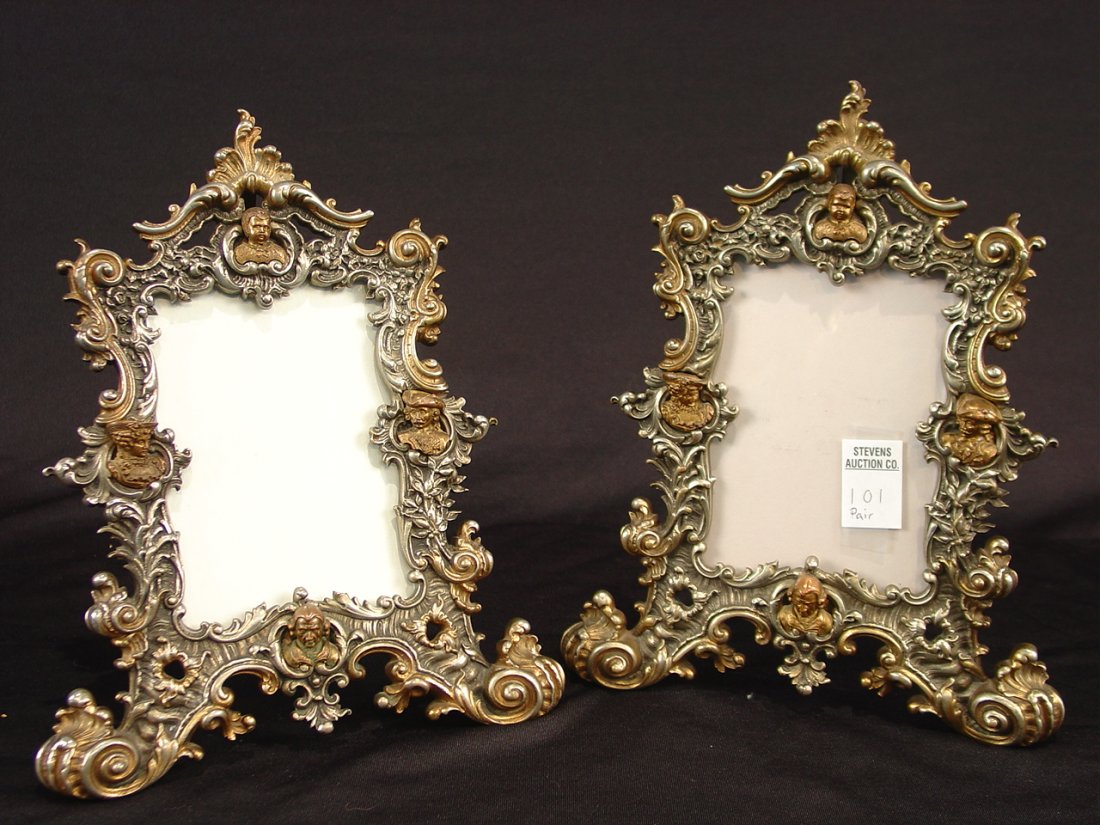 Pair of bronze picture frames with bronze heads in: Pair of bronze picture frames with bronze heads in relief - Victorian, 11in. T, 9in. W.