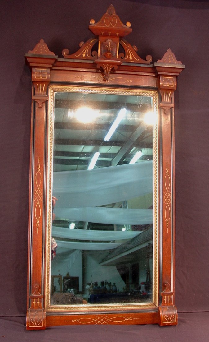 521: Walnut Victorian hanging mirror with gold sizing,: Walnut Victorian hanging mirror with gold sizing, 51in. T, 27in. W.
