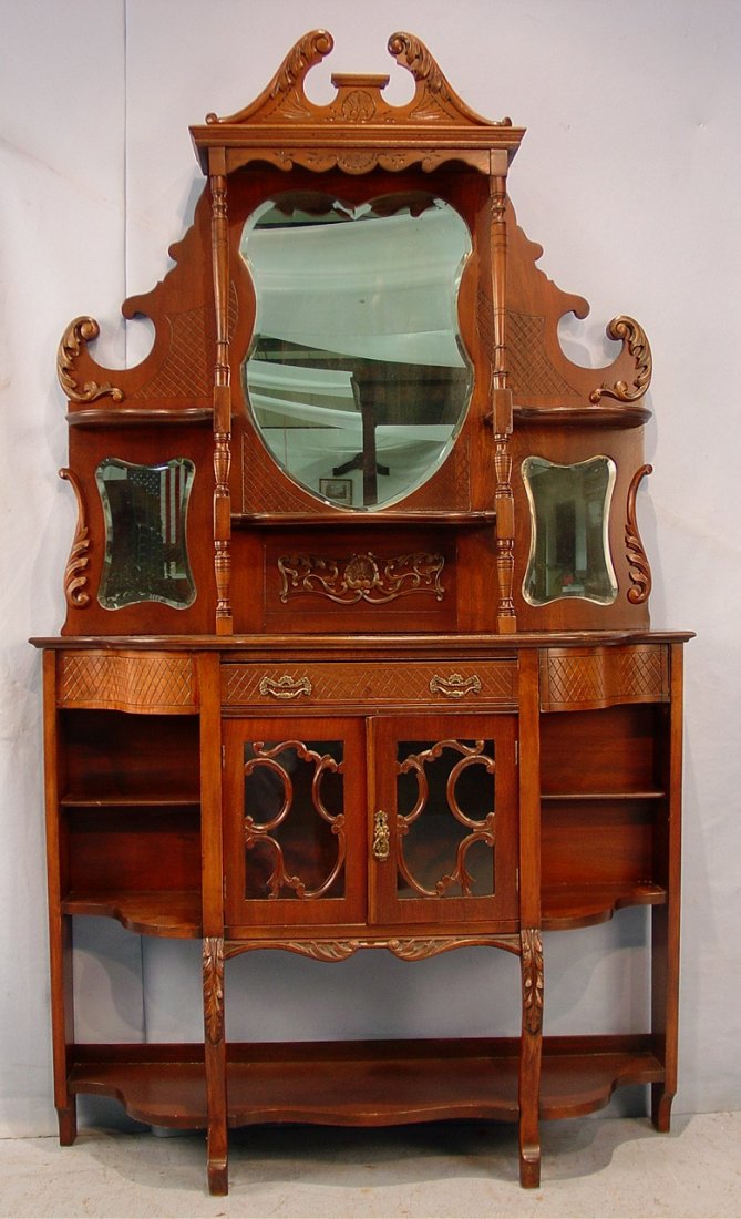 479: Walnut Victorian English etagere with beveled: Walnut Victorian English etagere with beveled heart shaped mirror, ca. 1900, 81in. T, 48in. W, 13in. D.