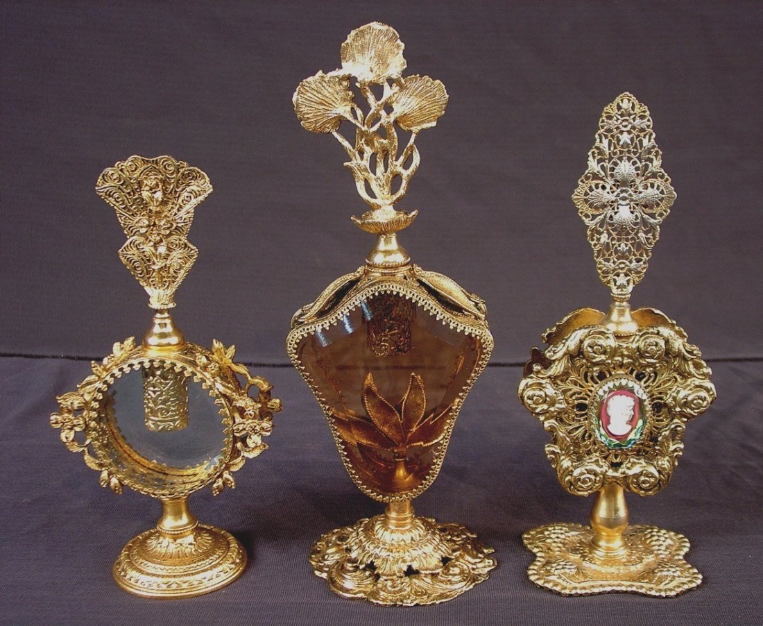 321: Collection of 3 gold ormolu French perfume: Collection of 3 gold ormolu French perfume bottles, tallest one is 11in. T.