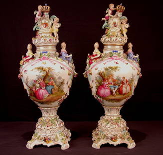 161: Pair of large 19th Century Dresden urns featuring: Pair of large 19th Century Dresden urns featuring courting scenes, floral encrustation, cherubs, maidens and etc., 27.5in. T, ca. 1890.