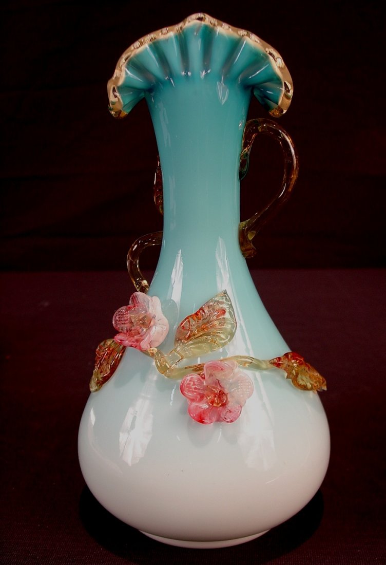 225: Blue art glass vase, att. To Stevens and Williams,: Blue art glass vase, att. To Stevens and Williams, with applied flowers and handles, 11in. T, ca. 1880.