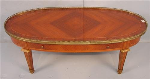 French coffee table with inlayed satin wood and: French coffee table with inlayed satin wood and rosewood, has a drawer and bronze trim, ca 1930 - 18.5 in. T, 50 in. W, 23 in. D