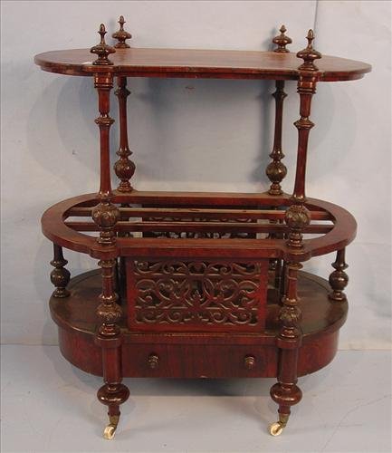 Rosewood Canterbury with table top and drawer, fret: Rosewood Canterbury with table top and drawer, fret work on front, oval shape, ca 1860 -42 in. T, 26 in. W, 22 in. D