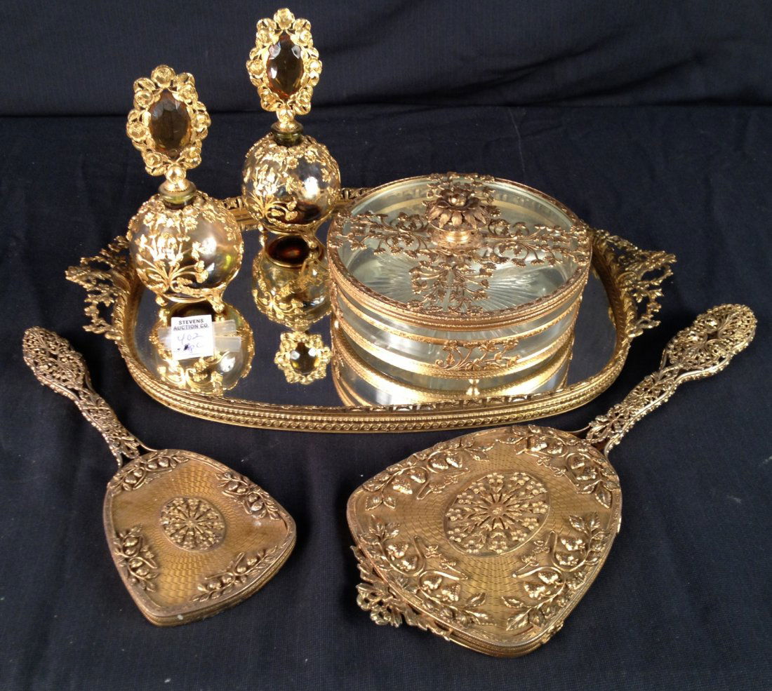 5-piece Early brass dresser set with a mirrored tray,: 5-piece Early brass dresser set with a mirrored tray, powder box, two hand mirrors & two perfume bottles