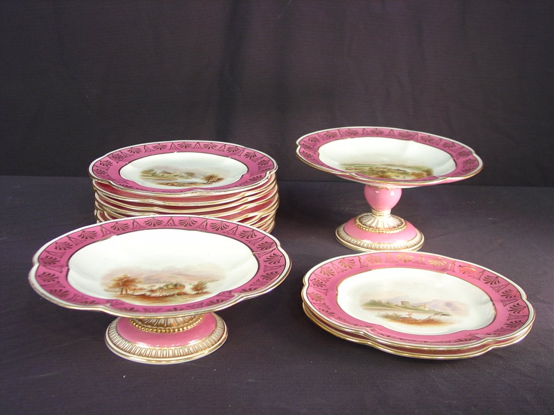 12: Old Paris dessert set, 2 compotes and 11 plates,: Old Paris dessert set, 2 compotes and 11 plates, pink with gold and different countryside scenes, ca 1880, 5.5IN T, 9.5IN R