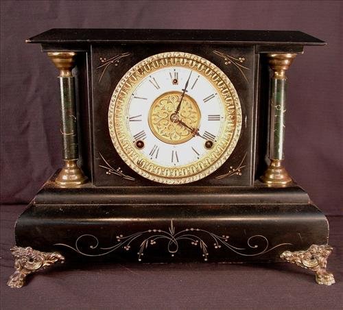 280: Black mantle clock, by Gilbert Clock Co., gold: Black mantle clock, by Gilbert Clock Co., gold trim dial ca. 1900 11INT x 15INW