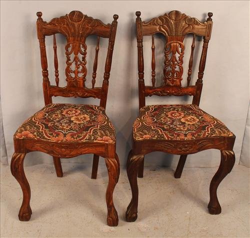 Pair rosewood Victorian side chairs: Pair of rosewood Victorian side chairs with brown floral seats, 35 in. T, 17 in. W, 15 in. D.