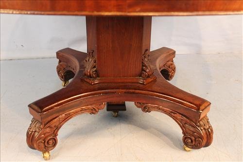 60 in. mahogany banquet table: 60 in. mahogany banquet table with 7 ten inch leaves and carved feet, 144 in. with leaves, 30 in. T
