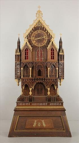 Tall floor model clock shaped like a house. (1 of 5)