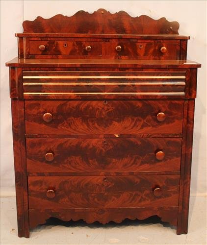 Flame mahogany Empire 6 drawer chest: Flame mahogany Empire 6 drawer chest with scalloped backsplash, has glove drawers, 40 in. T, 41 in. W, 22 in. D.