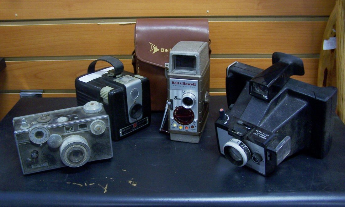 Lot of 4 Vintage Cameras: This is a lot of 4 Vintage cameras. The lot includes an Argus 35mm, Brownie Hawkeye, Bell & Howell 8mm and a Poloroid land camera called the Color Pack.