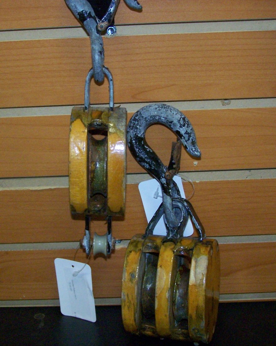 Pair of Antique Wooden Ships Pulleys with Hooks.: This is a great looking pair of antique Wooden Ships Pulleys. Each is approximately 10" long from the hook to the base of the wooden pulley.