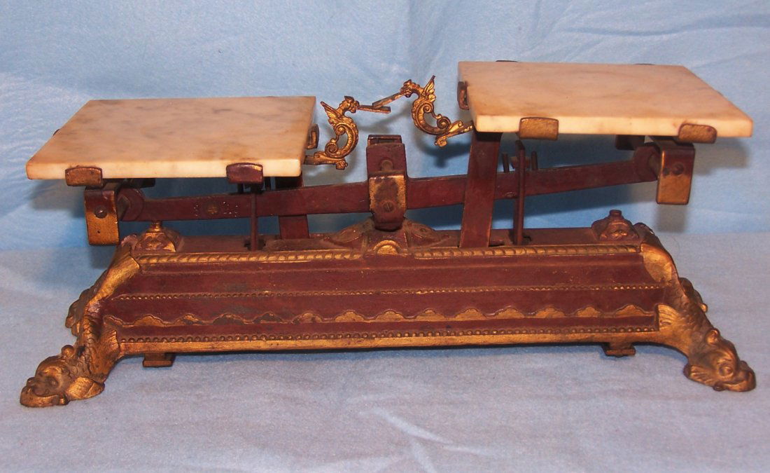 Vintage or Antique 3kg Scale with makers mark: This is a vintage or antique 3kg scale. It is a great looking item. The portion to set items is made of what appears to be marble. The feet are coy fish. There is a makers mark but we know very little