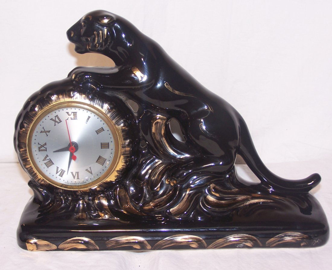 Snider's Clock Co. Toronto Black Panther TV or Mantle: Vintage Snider's Clock Company out of Toronto Canada Black Panther TV or Mantle Clock. The clock is in working condition. This was produced in the 1950's. Great Black Panther with Gold Gilt Accents. T