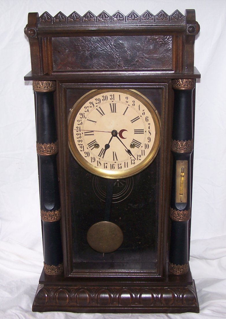 Antique Circa 1885 Gilbert 31 day Mantle Clock with: This is an absolutely fabulous Antique Gilbert 31 Day Mantle Clock. This clock dates to about 1885 and is the Eureka Model. It is adorned with ornate brass on the columns of the clock and on the right