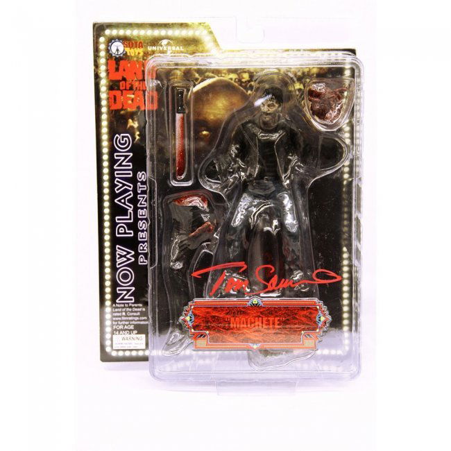 Tom Savini Signed Land of the Dead Machete Figure: Now Playing Presents Land Of The Dead "Machete" Action Figure Manufacturer: Sota Toys Measurements: 7 inches Signed by Tom Savini during his visit to the GeekRoom at Wizard World Philadelphia 2013 Tho
