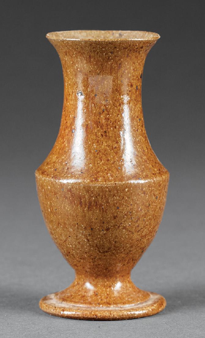 George Ohr Art Pottery Footed Vase: George Ohr Art Pottery Footed Vase, c. 1883-1898, baluster form, brown speckled glaze, base impressed "G.E.O. E. OHR/Biloxi, Miss", h. 5 1/4 in